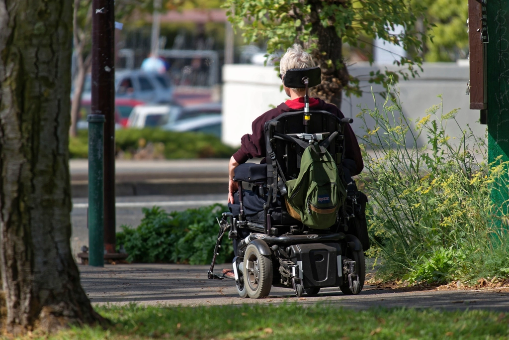 Man in power wheelchair.